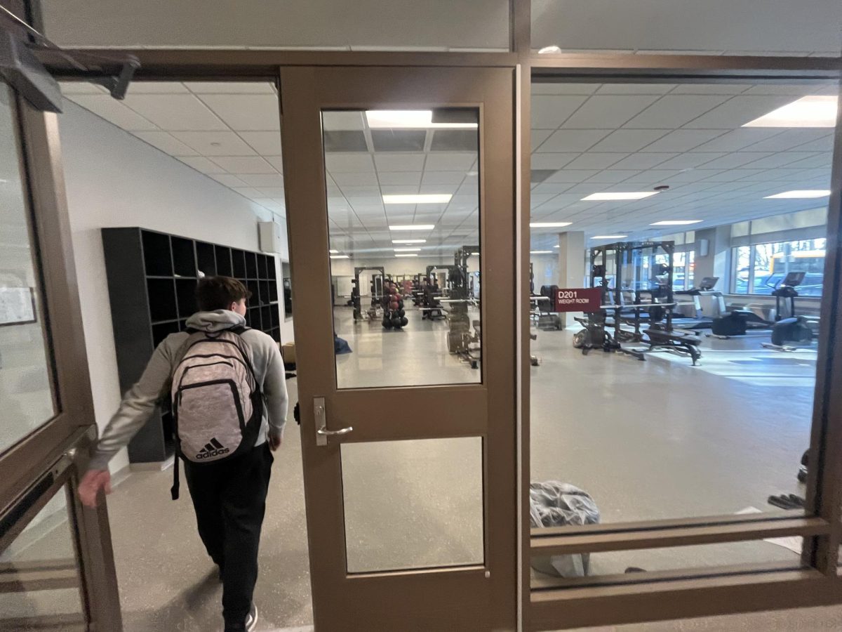 A student enters Doherty's weight room.