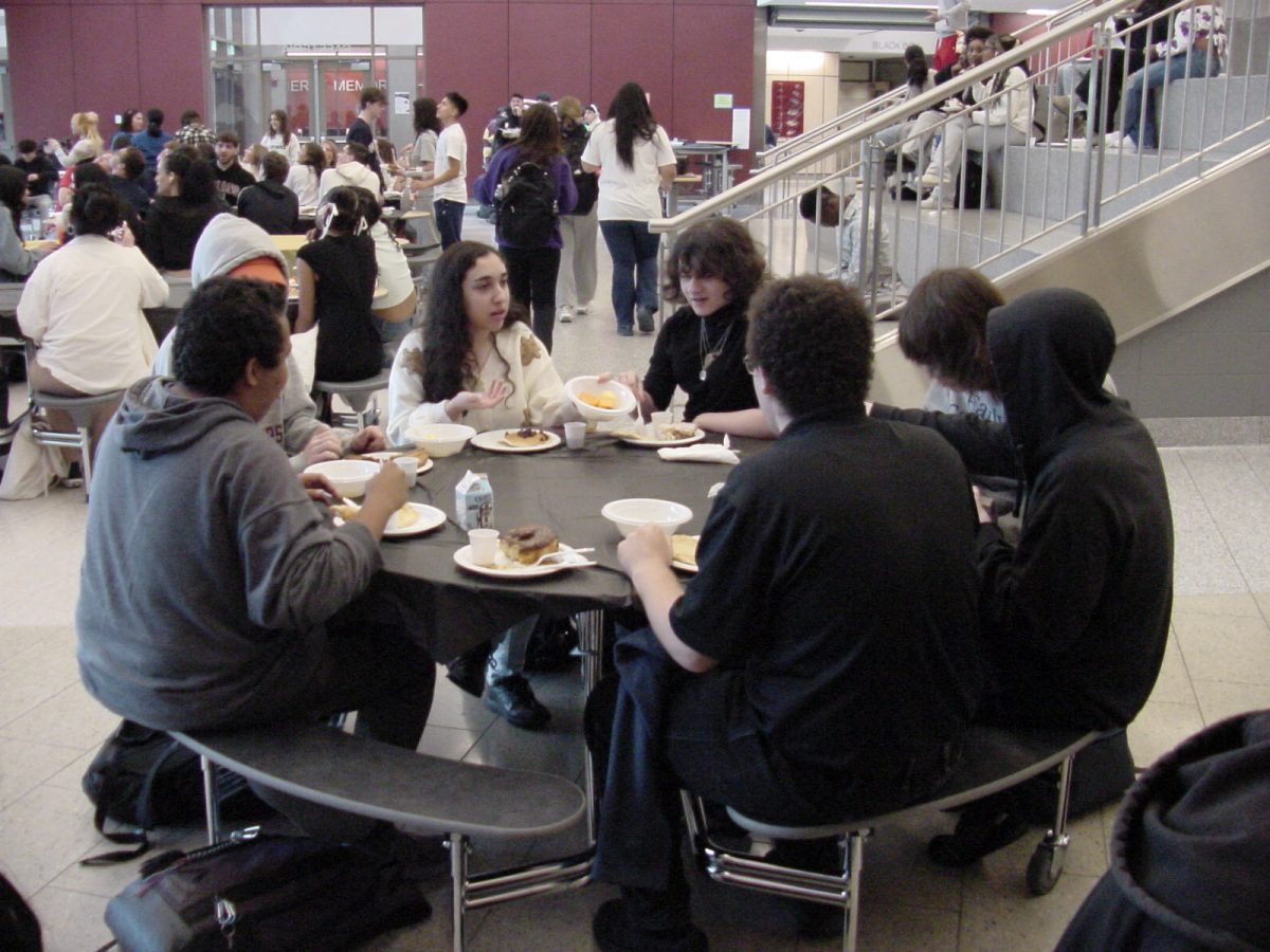 A table of friends eating. 