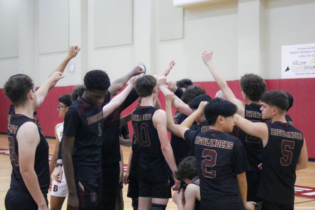 Junior captain Ben Dobson leads a huddle.
